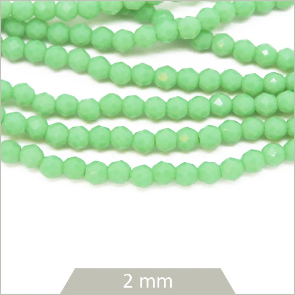 Env. 180 perles de verre rondes à facettes vert d'eau opaque, 2 mm