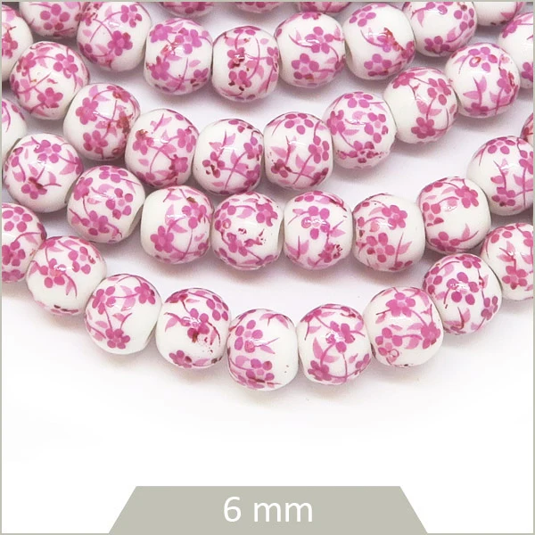 Env. 60 perles rondes céramique motif fleurs roses, 6 mm
