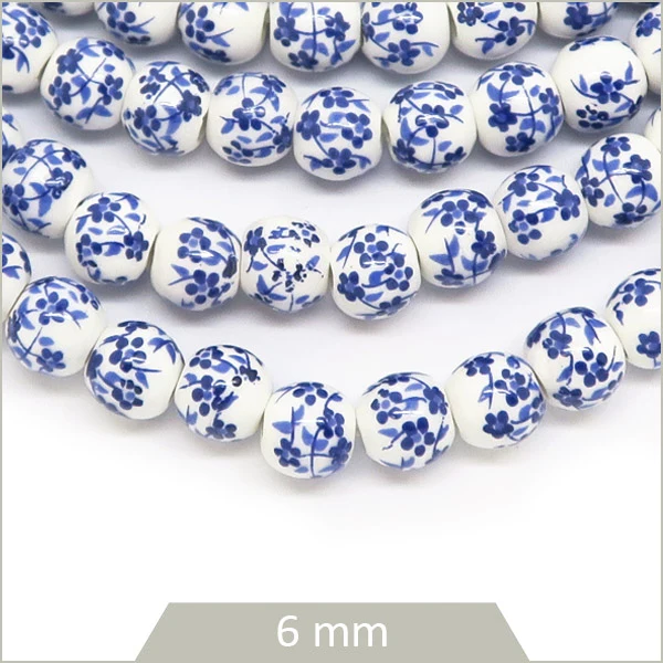Env. 60 perles rondes céramique motif fleurs bleues, 6 mm