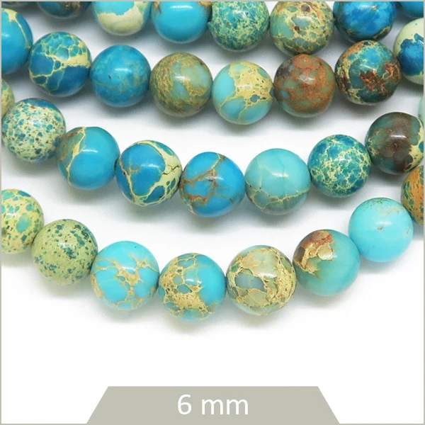 Env. 60 perles rondes Régalite teintée bleu ciel 6 mm