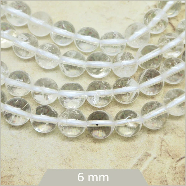 Env. 60 perles rondes en Quartz transparent 6 mm