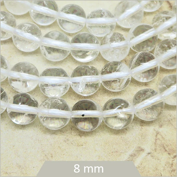 Env. 45 perles rondes en Quartz transparent 8 mm