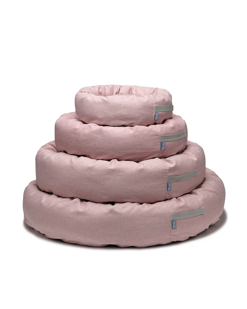 Cama redonda para perro rosa suave