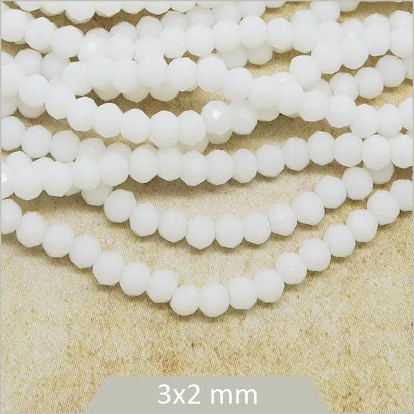 Env. 140 perles de verre à facettes donut, blanches 3x2 mm