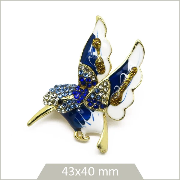 1 broche colibri alliage doré, émail bleu & blanc et strass