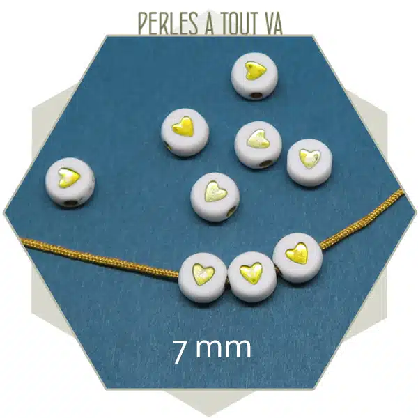10 g de perles coeur blanches et or (70 perles env.)