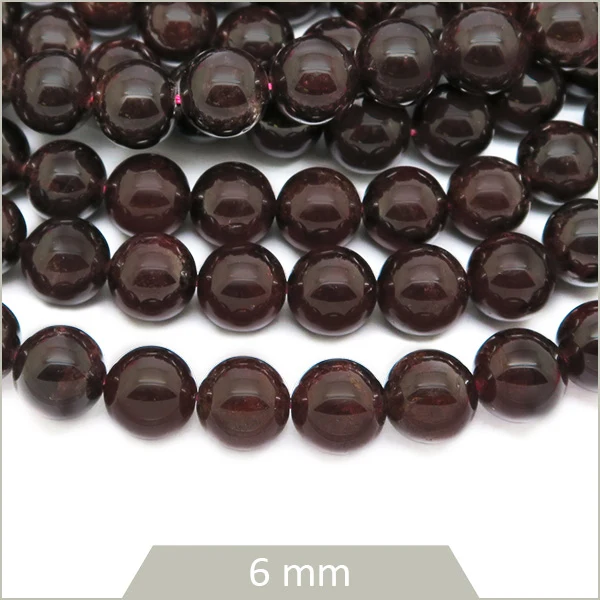 Env. 65 perles rondes en Grenat, 6 mm