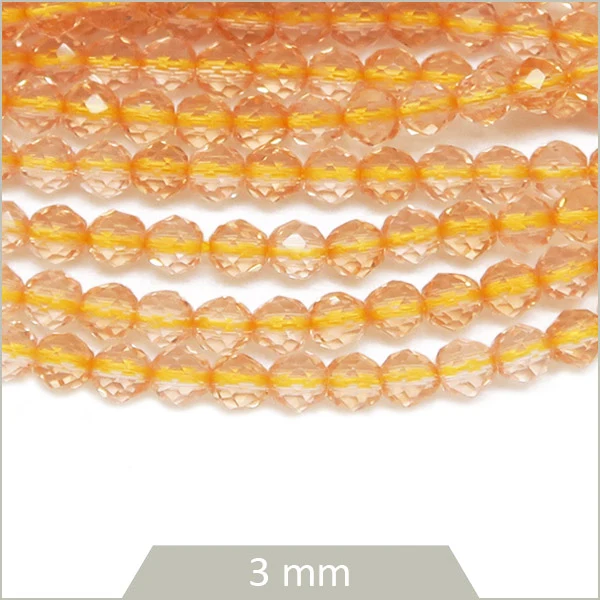 Env. 125 perles de verre à facettes champagne, 3 mm