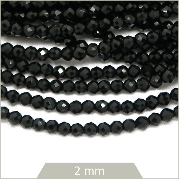 Env. 180 perles de verre à facettes noires, 2 mm