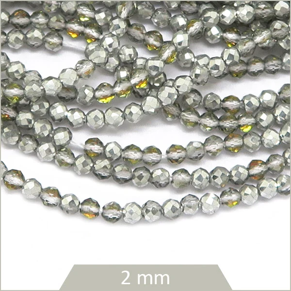Env. 180 perles de verre à facettes argent irisé reflets dorés, 2 mm