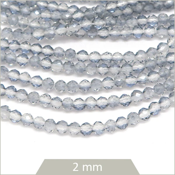 Env. 180 perles de verre à facettes grises transparentes, 2 mm