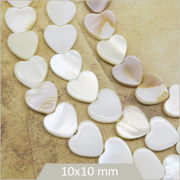 Env. 38 perles coeur en nacre 10 mm