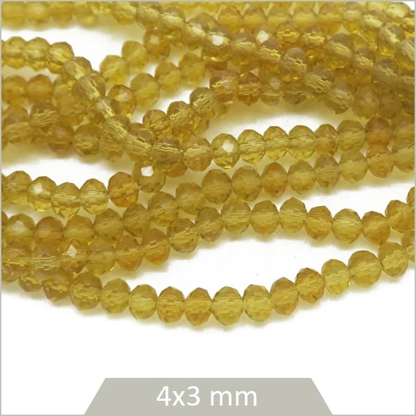 Env. 120 perles de verre à facettes donut transparentes couleur miel