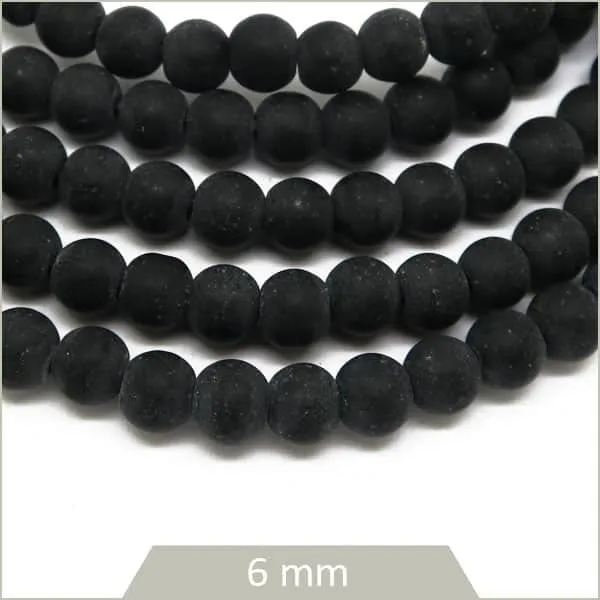 Env. 70 perles rondes en pierre noir reconstituée, 6 mm
