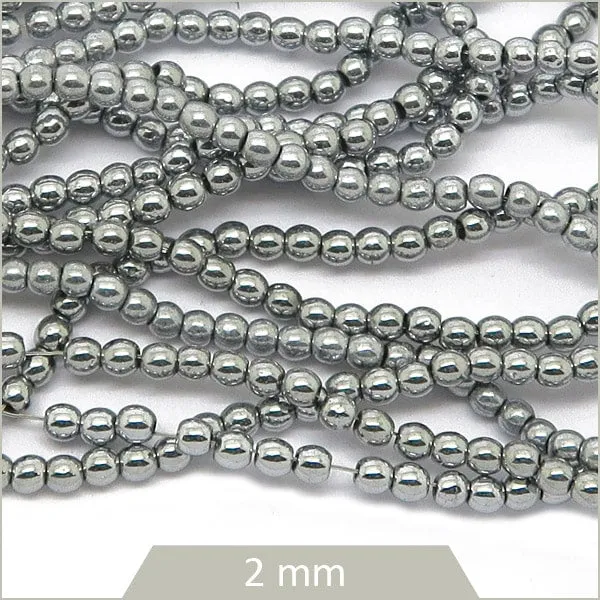 Env. 190 perles forme bille argent, éléments ronds hématite 2 mm