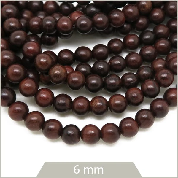 Env. 65 perles en bois brun foncé 6 mm