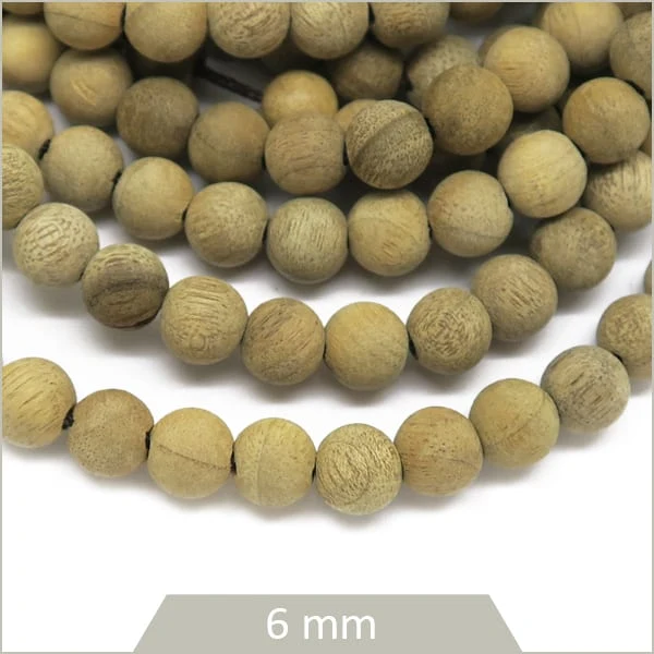 Env. 68 perles rondes de bois flotté, 6 mm