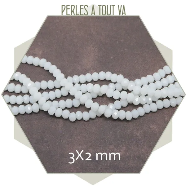 Env. 110 perles de verre à facettes donut blanc 3x2 mm