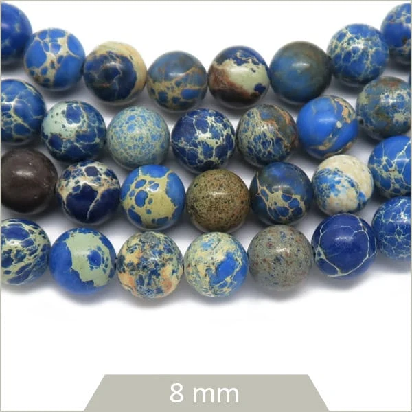 Env. 44 perles rondes Régalite teintée bleue 8 mm