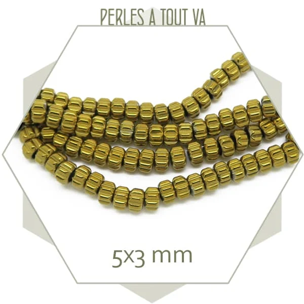 Env. 130 perles donut en hématite doré