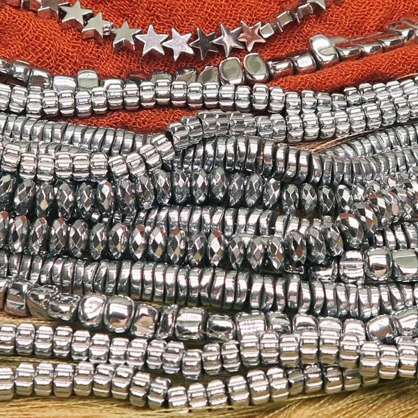 Env. 125 perles rondelles à facettes en hématite 6x3 mm