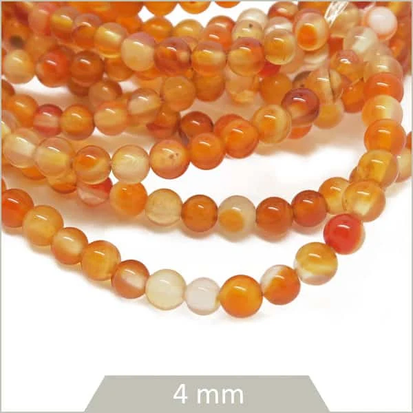 Env. 90 perles rondes 4 mm en Cornaline