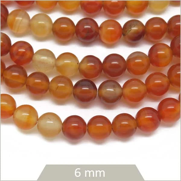 Env. 60 perles rondes 6 mm en Cornaline
