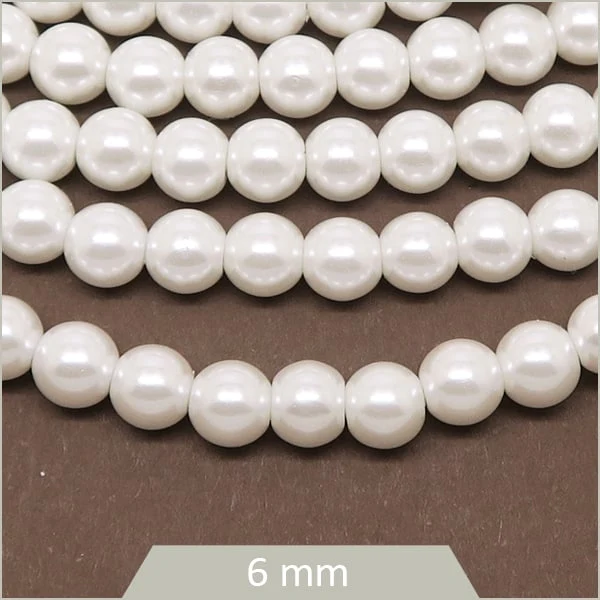 Env. 69 perles de verre nacrées blanc 6 mm