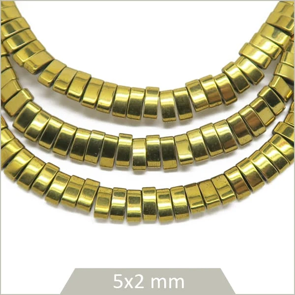 Env. 190 perles demi Tila en hématite doré