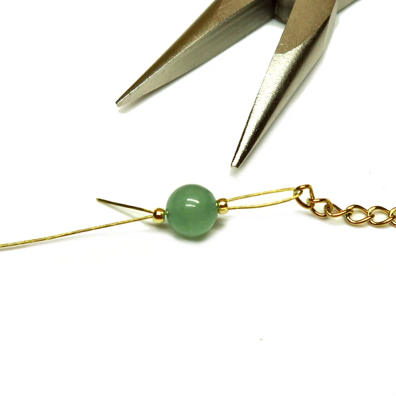 Env. 350 perles à écraser 2x1,5 mm en laiton brut