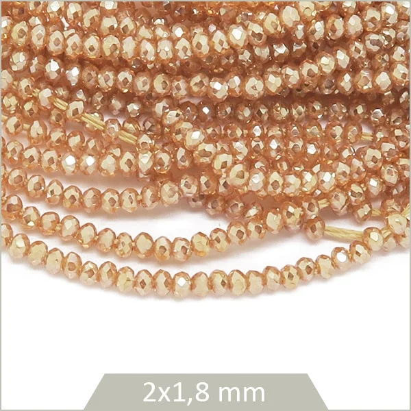 Env. 220 perles de verre donut 2x1,8 mm, nude irisé