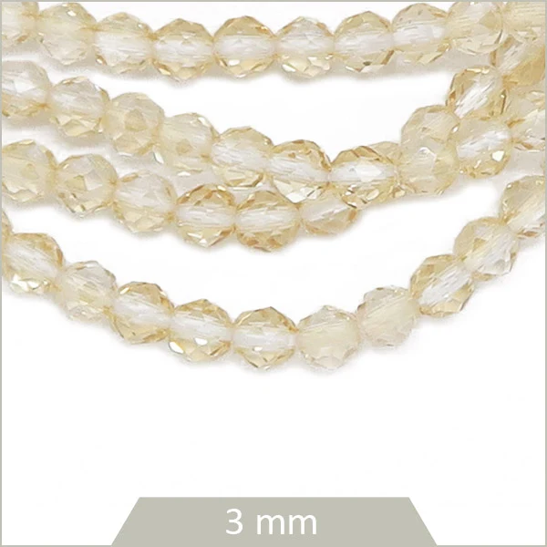 Env. 125 perles de verre à facettes beige transparentes, 3 mm