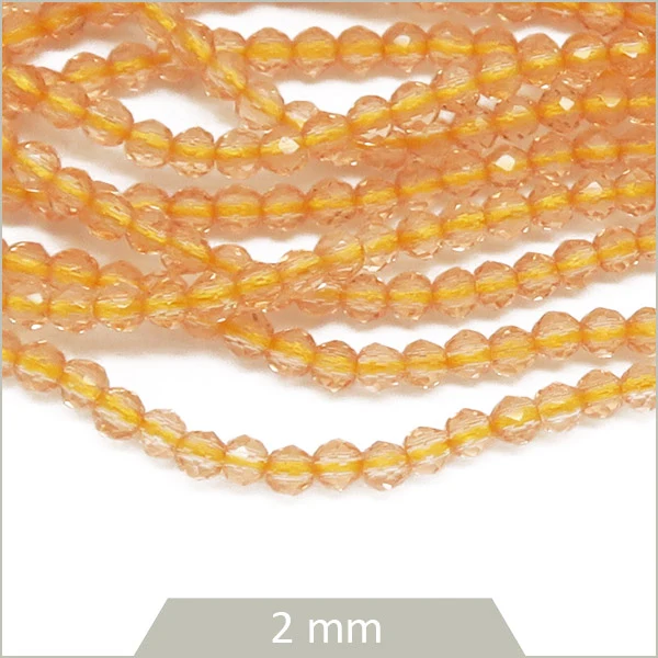 env. 182 perles de verre facettes champagne 2 mm