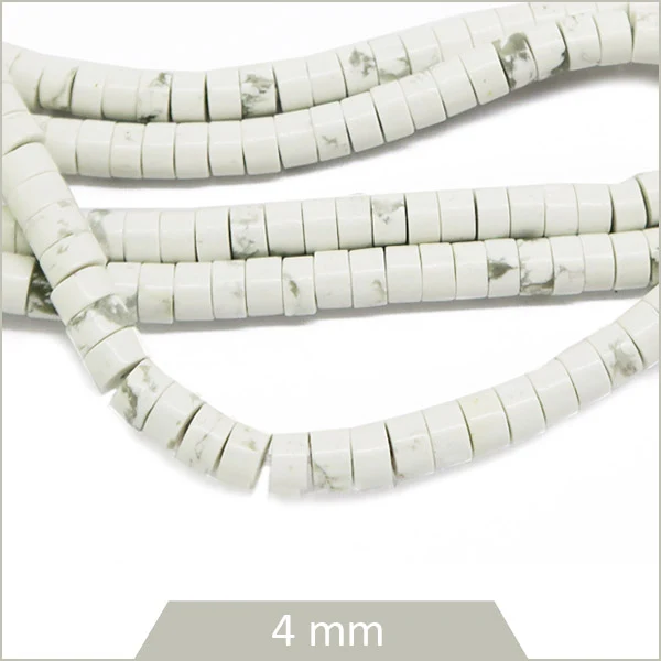 Env. 140 perles rondelles heishi en Howlite